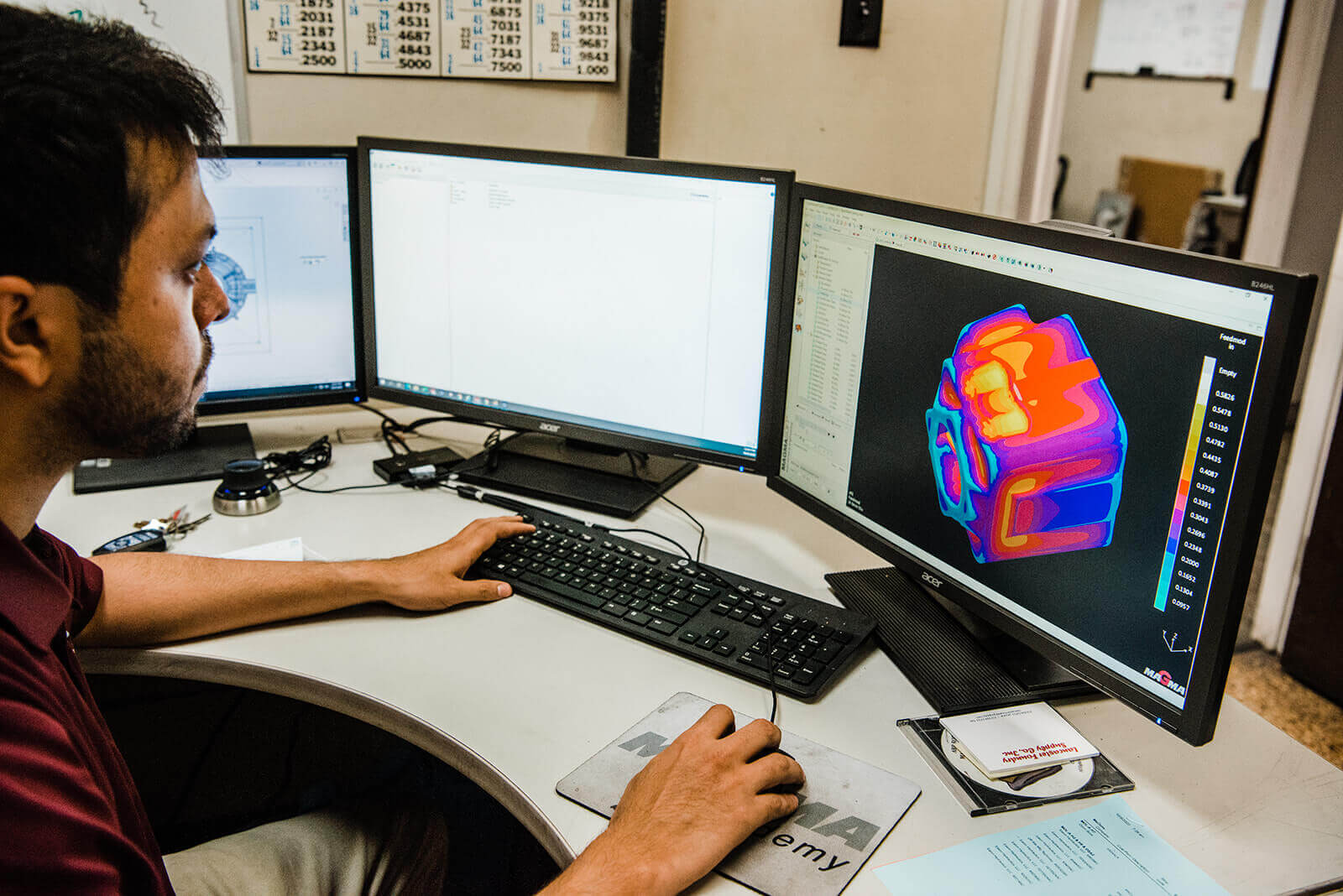 engineer at computer viewing solidification software