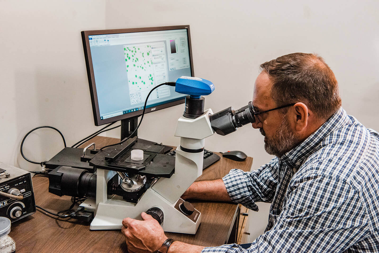 metallurgist at microscope