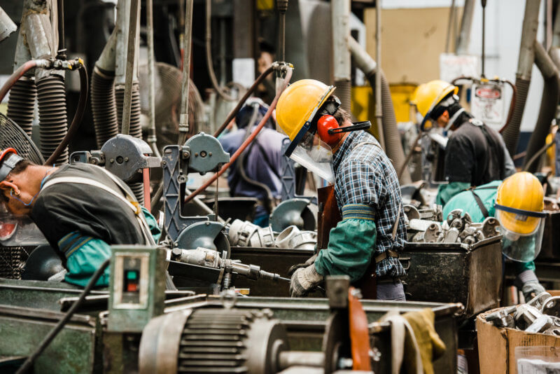 group of people working on machines
