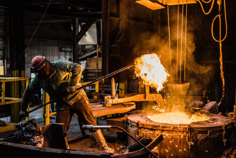  foundry worker pouring casting