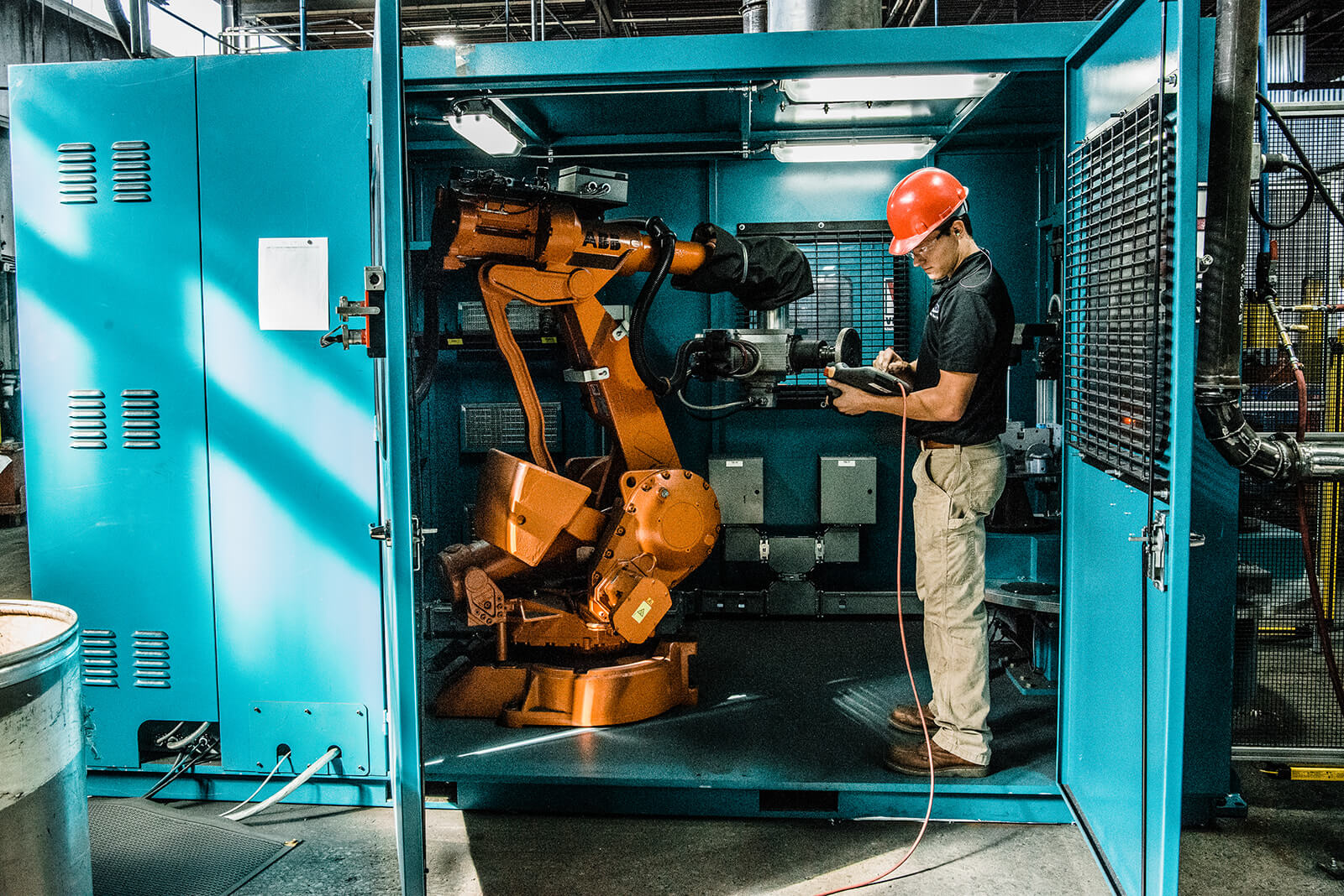 Person standing at machine